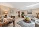 Open concept living room and dining area with coordinated decor at 619 Albee Farm N Rd, Nokomis, FL 34275