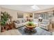 Cozy living room with neutral tones, comfortable seating, and natural light at 619 Albee Farm N Rd, Nokomis, FL 34275