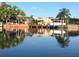 Waterfront view featuring a boat lift, dock, and calm water reflections in the community at 619 Albee Farm N Rd, Nokomis, FL 34275