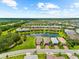 Lovely homes in the neighborhood near pond at 6791 Alstead Cir, Bradenton, FL 34202