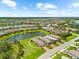 Lovely homes in the neighborhood near pond at 6791 Alstead Cir, Bradenton, FL 34202