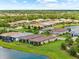 Sprawling community boasts manicured lawns, serene pond, and beautiful tile roofs at 6791 Alstead Cir, Bradenton, FL 34202