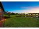 Serene backyard featuring a well-maintained lawn and a beautiful pond, perfect for relaxation at 6791 Alstead Cir, Bradenton, FL 34202