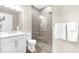 Bathroom featuring a glass shower, elegant fixtures, and towel rack for a clean, modern design at 6791 Alstead Cir, Bradenton, FL 34202