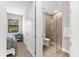 Bathroom featuring glass enclosed shower with light brown tiling and neutral colored walls at 6791 Alstead Cir, Bradenton, FL 34202