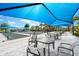 Bocce Ball court with seating under a blue canopy, for shade on those bright sunny days at 6791 Alstead Cir, Bradenton, FL 34202