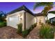 Charming home with a brick driveway, beautiful landscaping, and two-car garage at 6791 Alstead Cir, Bradenton, FL 34202