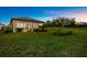 This home features a spacious backyard, screened-in patio, and a tranquil view at 6791 Alstead Cir, Bradenton, FL 34202