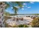 Lakeside firepit area with comfortable seating, perfect for relaxing and enjoying scenic views at 6791 Alstead Cir, Bradenton, FL 34202