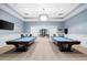 Bright community game room featuring two pool tables and comfortable seating at 6791 Alstead Cir, Bradenton, FL 34202