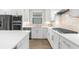 Close up of the white cabinets and stainless steel appliances in the bright kitchen at 6791 Alstead Cir, Bradenton, FL 34202