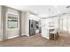 Bright kitchen featuring an island with seating, stainless steel appliances, and white cabinets at 6791 Alstead Cir, Bradenton, FL 34202