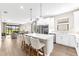 Bright kitchen with an island and seating, which is open to the living room at 6791 Alstead Cir, Bradenton, FL 34202