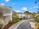 Exterior of the Lake House building, showcasing the attractive landscaping and waterfront setting at 6791 Alstead Cir, Bradenton, FL 34202