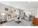 Inviting living room with stylish furnishings and seamless flow to the adjacent kitchen area at 6791 Alstead Cir, Bradenton, FL 34202