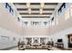 Clubhouse lobby with soaring ceilings, abundant seating, and elegant lighting creating a welcoming ambiance at 6791 Alstead Cir, Bradenton, FL 34202