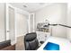 Bright office space with a modern style, featuring a bookcase and a stylish desk with a comfortable chair at 6791 Alstead Cir, Bradenton, FL 34202