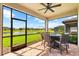 This screened patio offers lake views with outdoor dining and a great view at 6791 Alstead Cir, Bradenton, FL 34202
