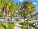 Beautiful pool and lounge area surrounded by lush landscaping and palm trees, perfect for relaxation at 6791 Alstead Cir, Bradenton, FL 34202
