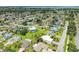 Aerial view of a neighborhood featuring a home, showcasing its location among lush greenery and the community at 6804 19Th W Ave, Bradenton, FL 34209