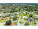 Beautiful aerial view of a suburban neighborhood, showcasing a charming home nestled amongst mature trees and green lawns at 6804 19Th W Ave, Bradenton, FL 34209