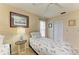 Bedroom featuring a twin bed, ceiling fan, neutral walls and closet at 6804 19Th W Ave, Bradenton, FL 34209