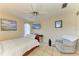 Bedroom featuring a bed, ceiling fan, neutral walls, wood furniture and a recliner at 6804 19Th W Ave, Bradenton, FL 34209