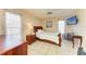 Bedroom featuring a bed, ceiling fan, neutral walls, wood furniture and a television at 6804 19Th W Ave, Bradenton, FL 34209