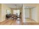 Bright dining area features wood floors, a glass table, four chairs, and large windows at 6804 19Th W Ave, Bradenton, FL 34209