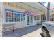 Exterior view of Two Scoops ice cream parlor featuring large windows and signage at 6804 19Th W Ave, Bradenton, FL 34209