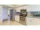 Well-lit kitchen features stainless steel appliances, granite counters and modern cabinetry at 6804 19Th W Ave, Bradenton, FL 34209
