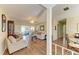 Inviting living room with wood floors, comfortable seating, and view into additional living area at 6804 19Th W Ave, Bradenton, FL 34209