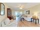Comfortable living room boasts wood floors, tasteful furnishings, and a relaxing atmosphere at 6804 19Th W Ave, Bradenton, FL 34209
