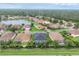 Beautiful community with lush landscaping, a central lake, and well-maintained homes at 7119 67Th E Ter, Bradenton, FL 34203