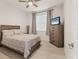 Cozy bedroom with natural light, neutral decor, and a ceiling fan at 7119 67Th E Ter, Bradenton, FL 34203