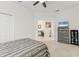 Relaxing bedroom with view to the hallway with modern furnishings and neutral tones at 7119 67Th E Ter, Bradenton, FL 34203