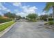 Gated community entrance with landscaping and access road at 7119 67Th E Ter, Bradenton, FL 34203
