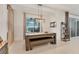 Bright game room featuring a pool table and outdoor views, perfect for leisure and entertainment at 7119 67Th E Ter, Bradenton, FL 34203