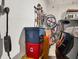 Well-organized garage featuring storage, bike racks, and an electric vehicle charger at 7119 67Th E Ter, Bradenton, FL 34203
