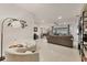 Open-concept living room featuring tile floors, modern decor, and plenty of natural light at 7119 67Th E Ter, Bradenton, FL 34203