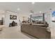 Spacious living room with a ceiling fan, expansive seating, and easy access to the outdoors at 7119 67Th E Ter, Bradenton, FL 34203