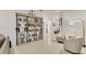 Well-appointed living room with built-in shelving, neutral walls, and tile flooring at 7119 67Th E Ter, Bradenton, FL 34203