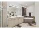 Elegant main bathroom with a soaking tub, double vanity, and modern fixtures at 7119 67Th E Ter, Bradenton, FL 34203