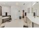 Bright and spacious main bathroom featuring a soaking tub, dual vanities, and modern design at 7119 67Th E Ter, Bradenton, FL 34203