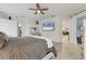 Bright main bedroom with a TV, walk-in closet, and an ensuite bathroom at 7119 67Th E Ter, Bradenton, FL 34203