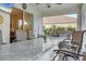 A covered bar area with granite counter, grill, and seating area for entertaining at 7119 67Th E Ter, Bradenton, FL 34203