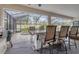 Expansive screened in pool area features a bar, multiple seats and a spa at 7119 67Th E Ter, Bradenton, FL 34203