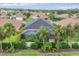 Aerial view of home showcasing backyard, pool area with screened enclosure, and landscaping at 7119 67Th E Ter, Bradenton, FL 34203