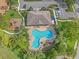 High angle aerial view of the community pool, clubhouse, playground and parking at 7325 Skybird Rd # 399, Bradenton, FL 34209
