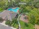 Aerial view of the community pool, playground, parking and landscaping at 7325 Skybird Rd # 399, Bradenton, FL 34209